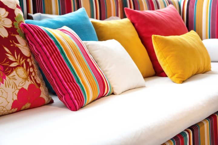 Olefin Cushions different colors on a couch
